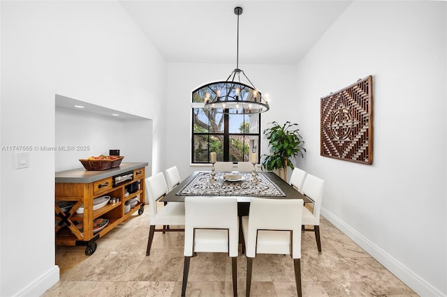 dining area featuring an inviting chandelier