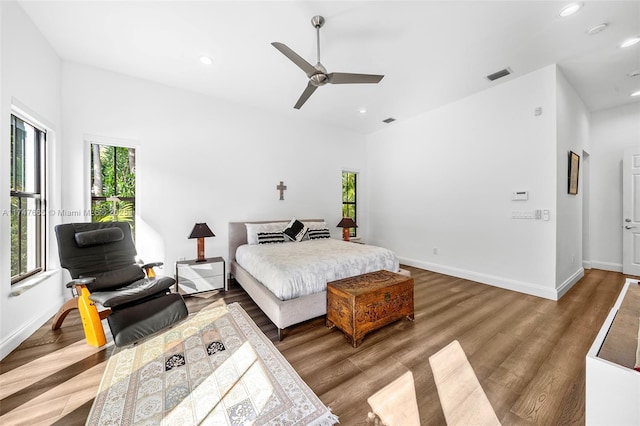 bedroom with ceiling fan and wood-type flooring