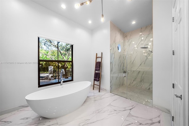 bathroom featuring shower with separate bathtub