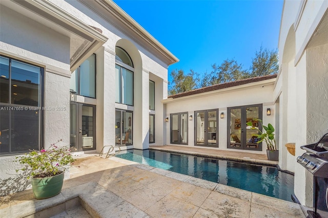 view of swimming pool featuring a patio area