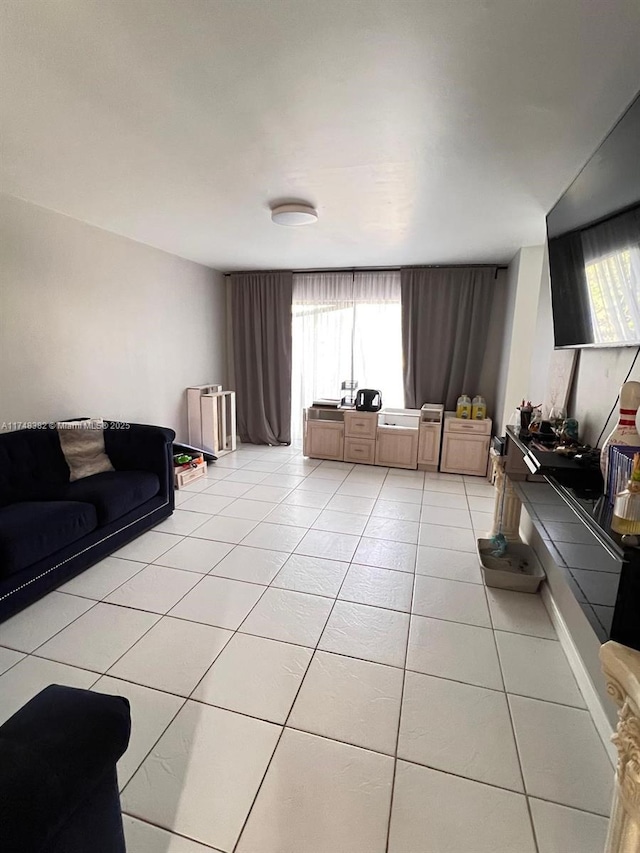 living area with light tile patterned floors