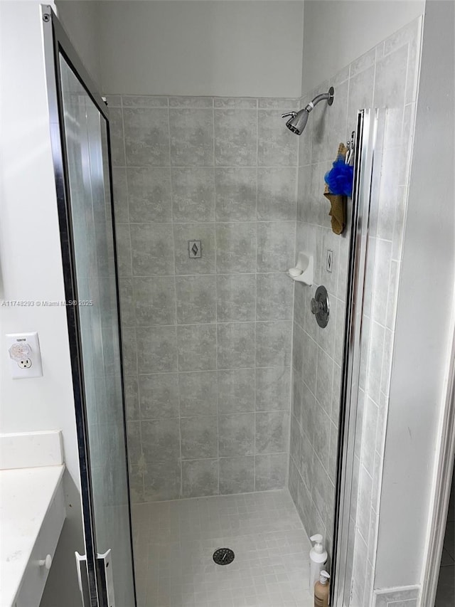 full bath featuring a shower stall