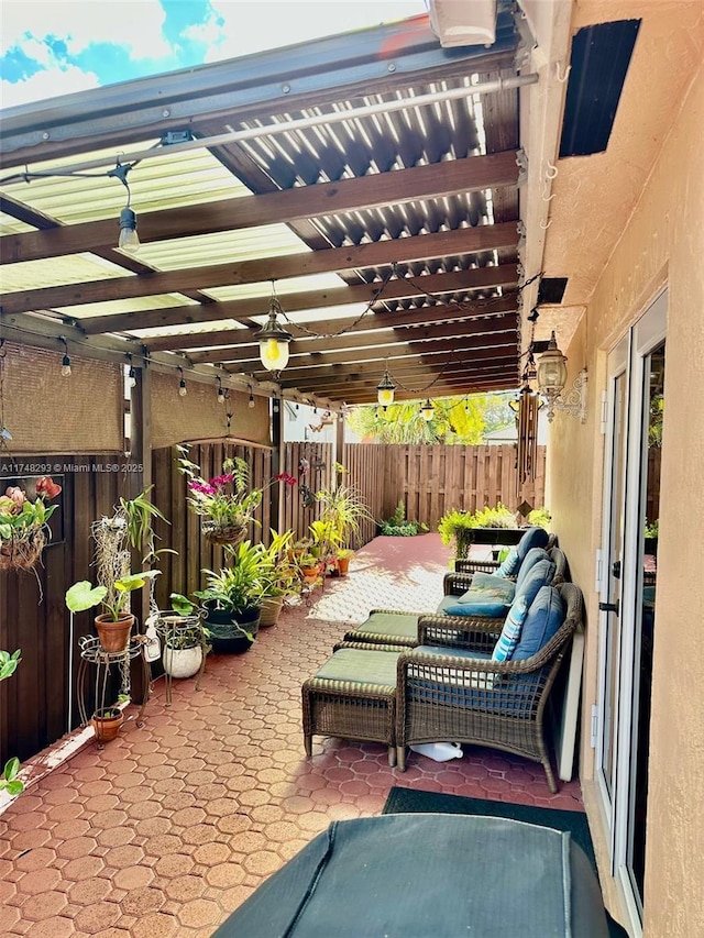 view of patio / terrace featuring fence
