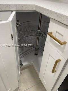 interior details featuring white cabinets