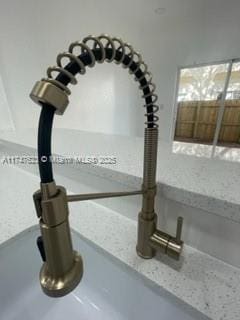 interior details with sink and light stone counters