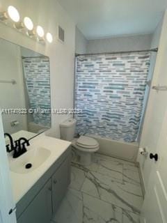 full bathroom featuring toilet, shower / bath combo, and vanity