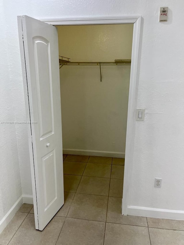 walk in closet featuring light tile patterned floors