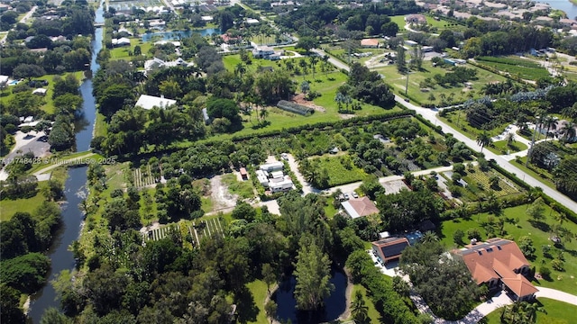 aerial view featuring a water view and a residential view