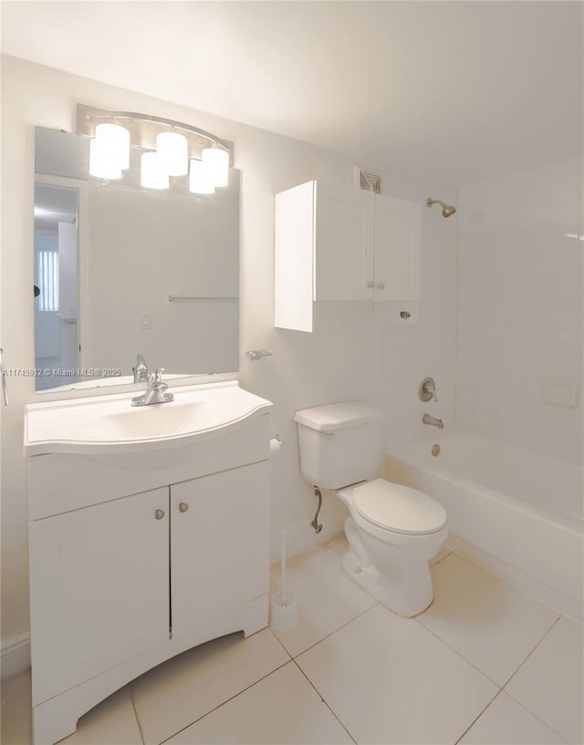 full bathroom with tiled shower / bath combo, vanity, toilet, and tile patterned flooring