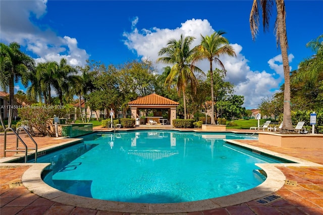 view of pool with a patio area and a gazebo