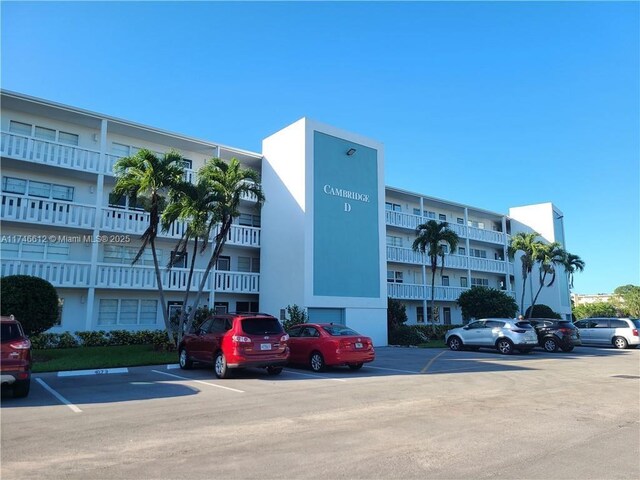 view of property with uncovered parking