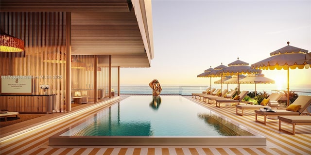 pool at dusk with a water view