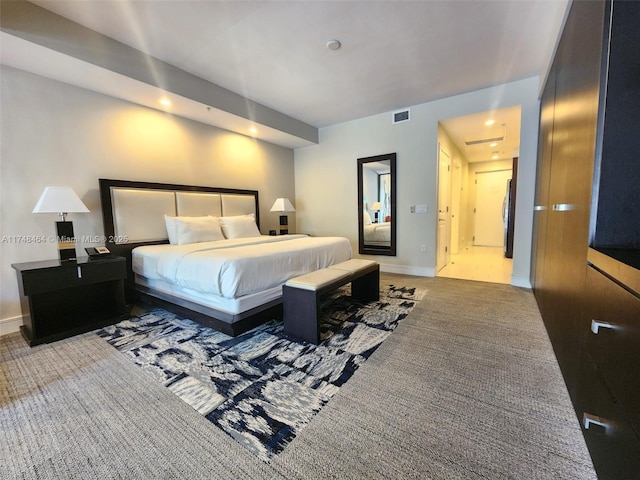 carpeted bedroom featuring stainless steel refrigerator