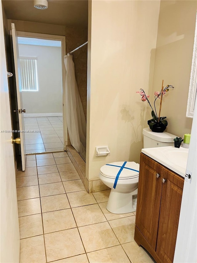 bathroom featuring toilet, tile patterned flooring, a shower with shower curtain, and vanity