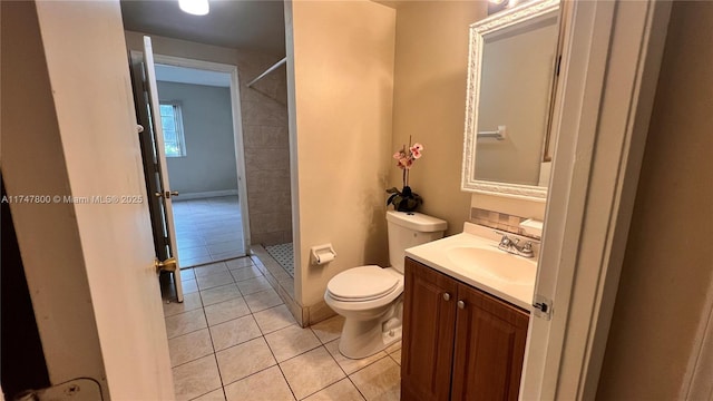 full bathroom featuring tile patterned floors, toilet, vanity, and a stall shower