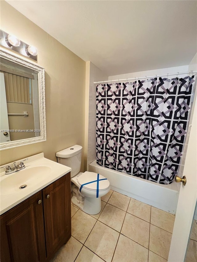 full bath featuring toilet, vanity, tile patterned flooring, and shower / tub combo with curtain