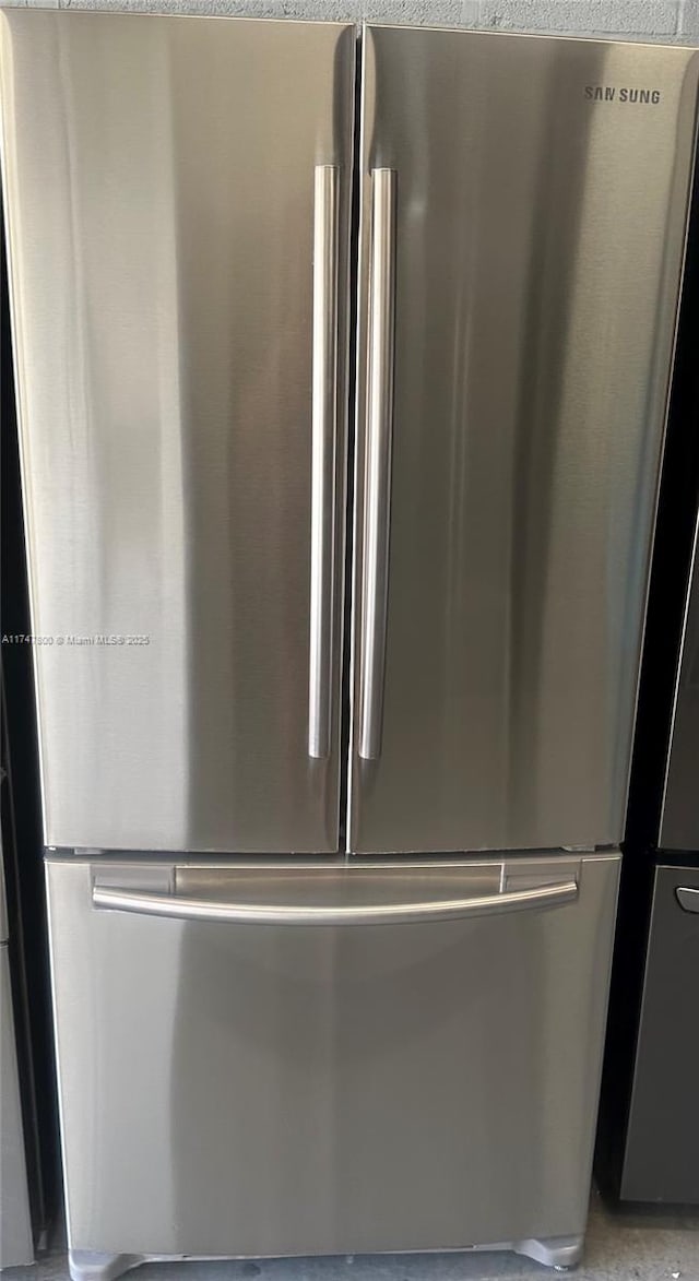 room details featuring stainless steel fridge