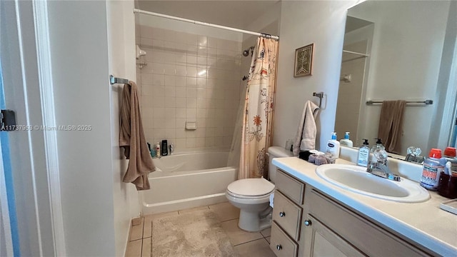 full bathroom featuring shower / bath combo with shower curtain, vanity, tile patterned flooring, and toilet