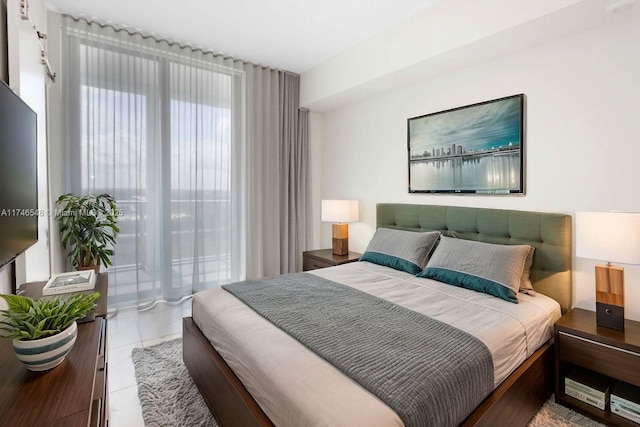 bedroom featuring light tile patterned floors