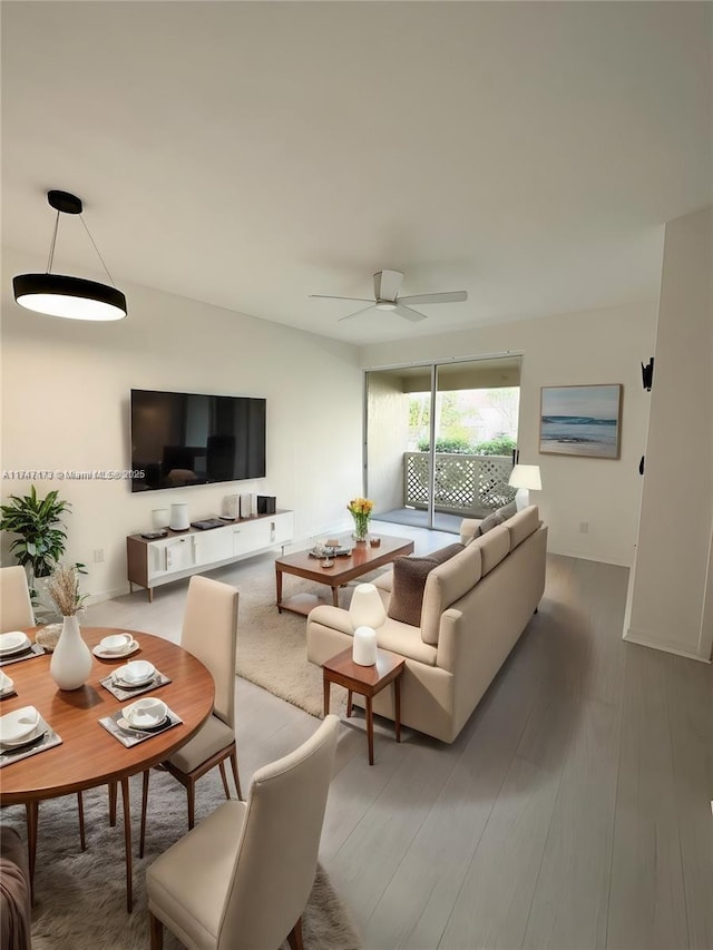 living room with hardwood / wood-style flooring and ceiling fan