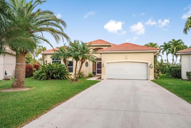 mediterranean / spanish-style house with a garage and a front lawn