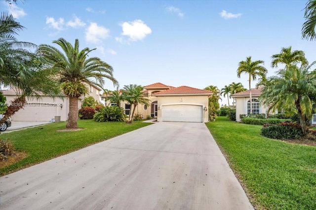 2813 Augusta Ln, Homestead, FL 33035 - mediterranean / spanish-style home featuring stucco siding, concrete driveway, a garage, a front yard, and a tile roof