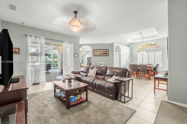 2813 Augusta Ln, Homestead, FL 33035 - living room featuring arched walkways, light tile patterned floors, plenty of natural light, and ceiling fan