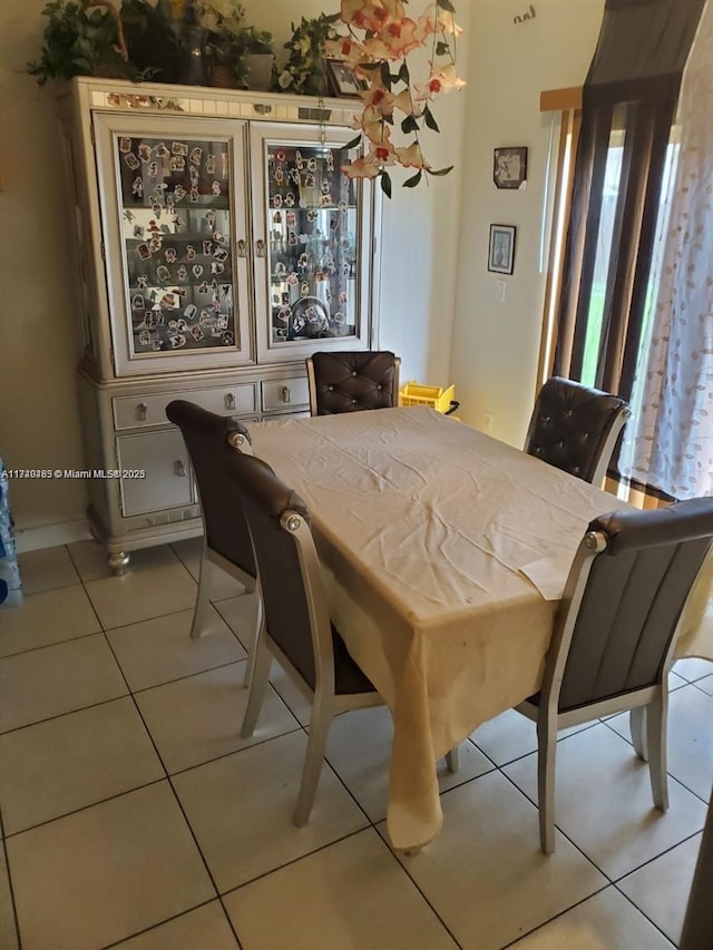 dining area with light tile patterned floors