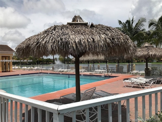 view of swimming pool with a patio