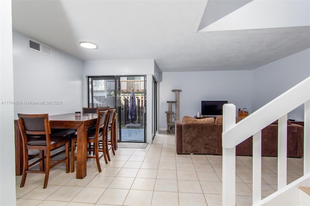 dining room featuring visible vents and tile patterned floors