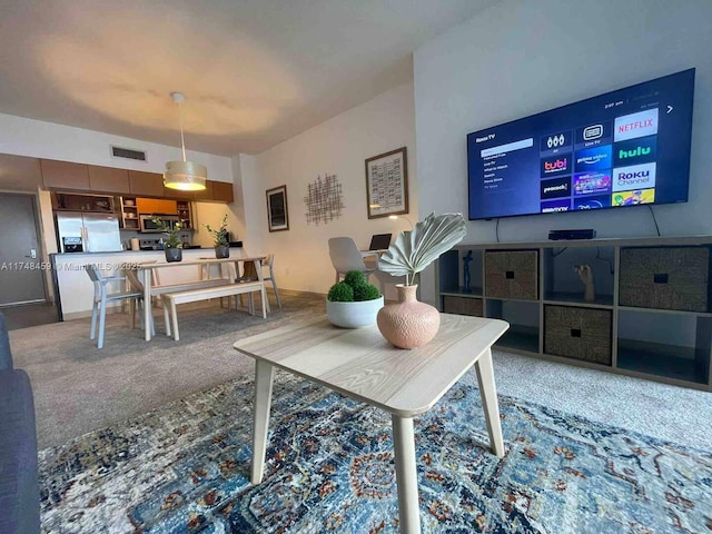 living room featuring carpet flooring