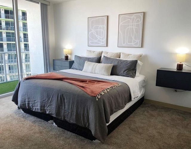 carpeted bedroom featuring multiple windows