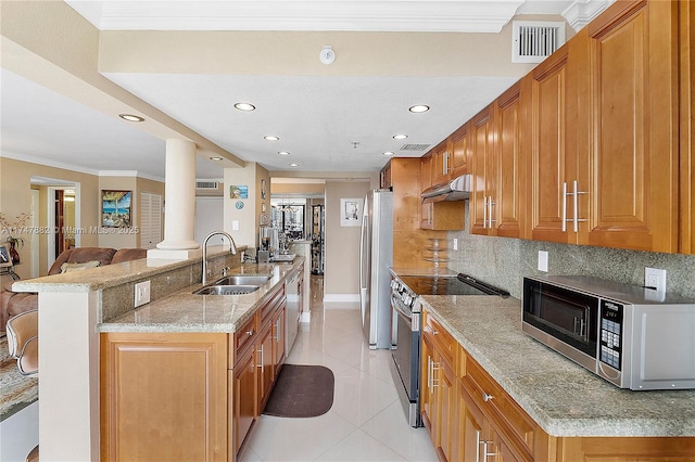 kitchen featuring stainless steel appliances, decorative backsplash, light tile patterned flooring, crown molding, and sink