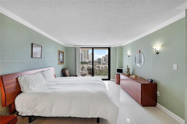 bedroom with a textured ceiling, access to exterior, and ornamental molding