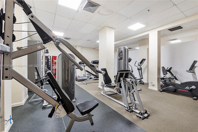 workout area with a paneled ceiling