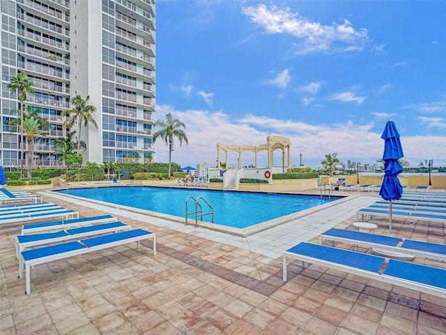 view of pool featuring a pergola and a patio area