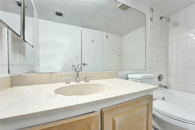 full bath with visible vents, shower / washtub combination, vanity, and toilet