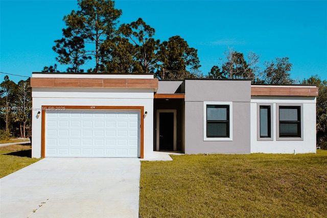 contemporary home featuring a garage and a front yard