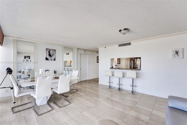 dining room featuring a textured ceiling