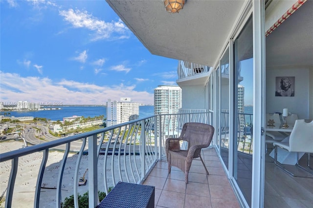 balcony featuring a water view