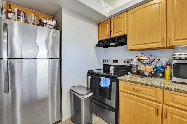 kitchen with appliances with stainless steel finishes and light stone countertops