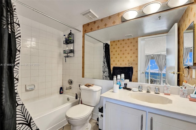 full bathroom featuring vanity, shower / tub combo, and toilet