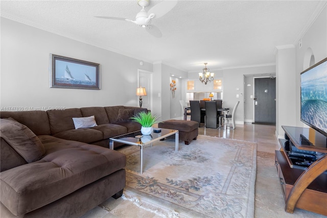 living room featuring ceiling fan with notable chandelier, crown molding, and a textured ceiling