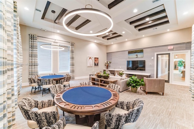 playroom featuring baseboards, beam ceiling, coffered ceiling, and a high ceiling