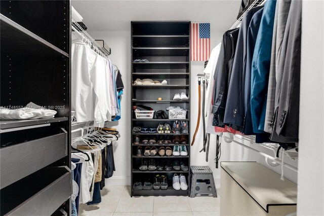 walk in closet featuring light tile patterned flooring