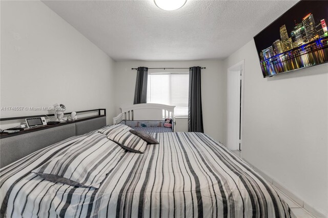 bedroom featuring a textured ceiling