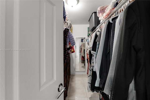 spacious closet with light tile patterned flooring