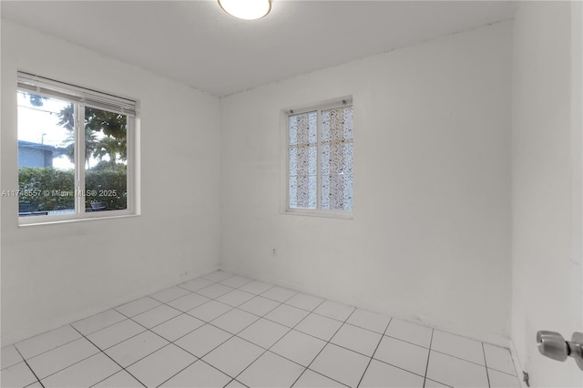 empty room with light tile patterned floors