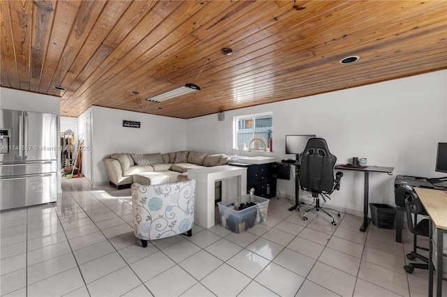 living area with light tile patterned floors, wood ceiling, and baseboards