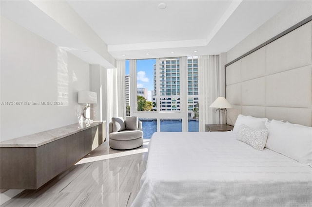 bedroom with a wall of windows